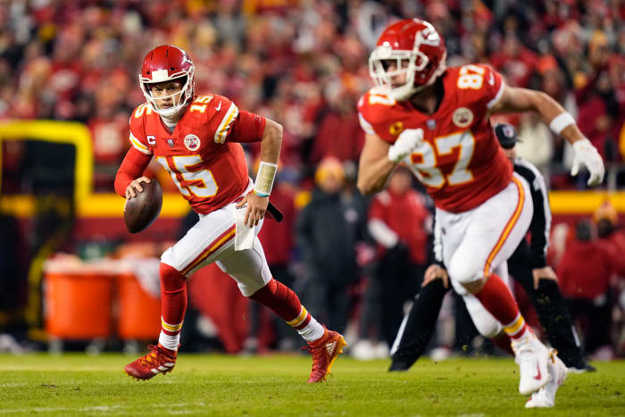 Jan 16, 2022; Kansas City, Missouri, USA; Kansas City Chiefs quarterback Patrick Mahomes (15) runs with the ball behind tight end Travis Kelce (87) during the first quarter against the Pittsburgh Steelers in an AFC Wild Card playoff football game at GEHA Field at Arrowhead Stadium. Mandatory Credit: Jay Biggerstaff-USA TODAY Sports